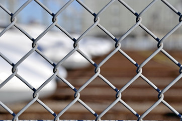 Naklejka premium Wire mesh fence enclosing the Shinkansen rail yards 