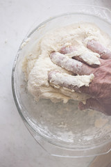 Hand in dough