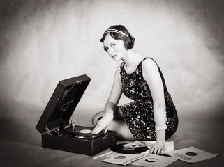 Girl with gramophone and phonograph records