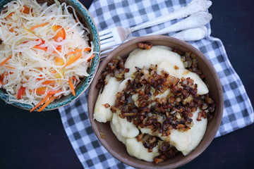 vareniki with bacon and coleslaw, top view