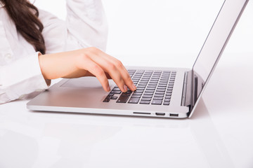 Laptop woman. Business Woman  with glasses using laptop computer pc. Isolated on white background.