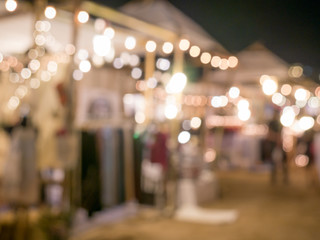 Blurred background: night market shopping with lighting decorati