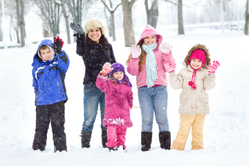Happy family enjoying in winter