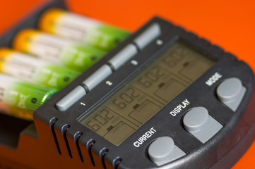 Power Battery Charger  with rechargeable batteries. Technology concept.