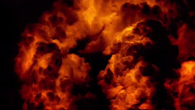 Huge night fire on a gas or oil well or broken petrol pipe. Clouds of fire with black smoke at night. The hell flame of the Gehenna, empire of fire.