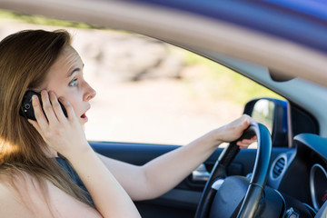 Naklejka premium Beautiful business woman driving a car