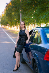 Beautiful business woman near her car
