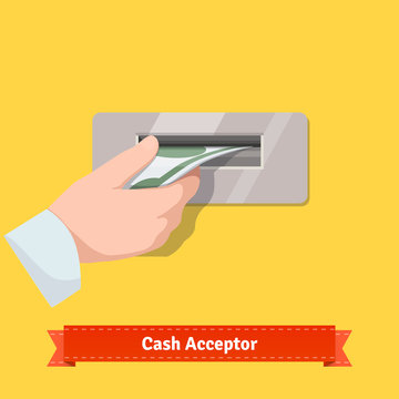 Human hand putting banknote to a cash validato