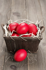 Red Easter eggs in basket