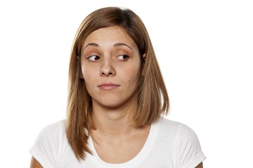 serious young woman looking away with distrust