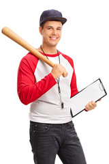 Young male baseball coach holding a clipboard