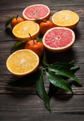 Citrus Fruit on vintage wood table, including oranges, mandarins and grapefruits