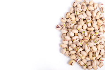 Salt pistachios on a white background. Free space for your text.