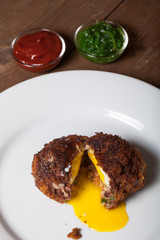Fried cutlet  with egg inside served on a plate. Selective focus