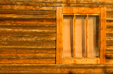 timbered wall of a village house with a window background