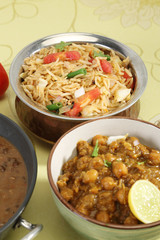 Indian Pulav or Vegetable Pulao with Chana Masala and Dal Makhan