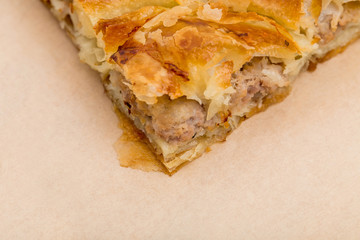 Closeup of cake with chicken meat.