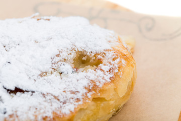 Delicious puff cake with sugar powder.