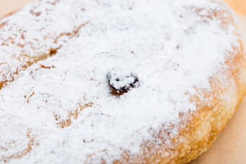 Delicious puff cake with sugar powder.