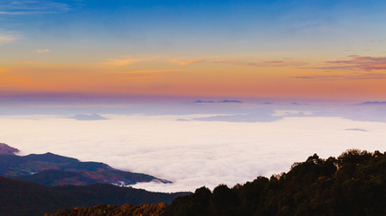 Naklejka premium mountains under mist in the morning.