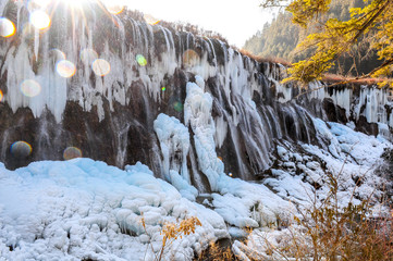 Fototapeta na wymiar Frozen water fall in Jiuzhaigou, China