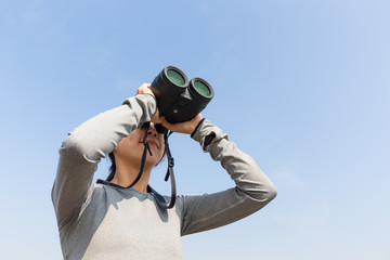 Woman use of the binocular