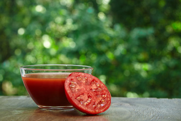 Half of tomato and juice