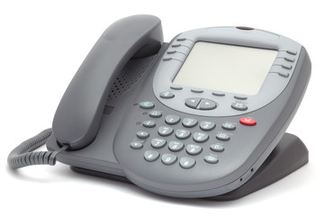 Modern office system phone with large LCD screen. Isolated on wh