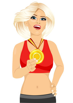 female athlete showing her gold medal