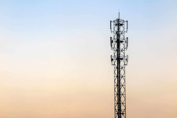 Telecommunication cellular tower on twilight background. Used to