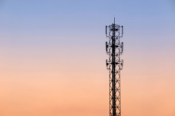 Telecommunication cellular tower on twilight background. Used to