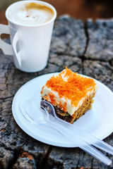 Coffee cup with bakery on wood table