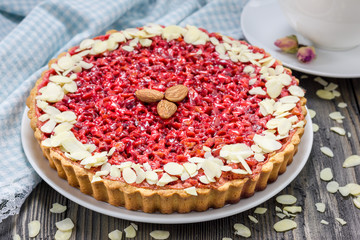 Homemade pink praline tart, almond tart.