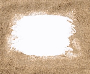 Naklejka na ściany i meble White frame surrounded by sand