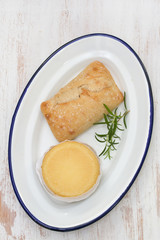 cheese with bread on white plate
