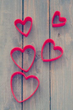 red hearts on blue wooden background