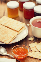 jam with cookies, spoon and cup of tea