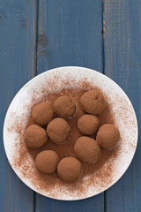 home made dessert on white plate on blue wooden background