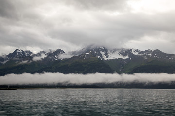 Ocean waves at sunrise clouds and storm along shore