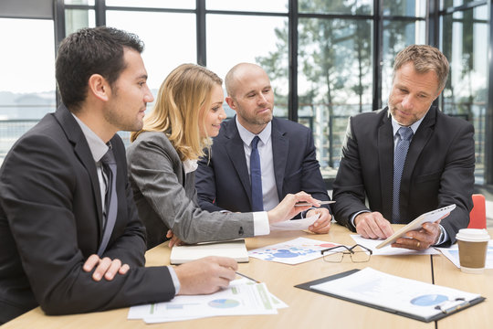 Group of business people having meeting in office