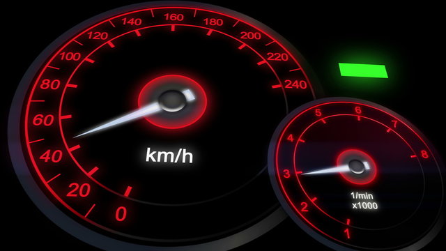 close up illuminated Revving Speedometer and Tachometer, car dashboard. Engine start and reach to the most speed.