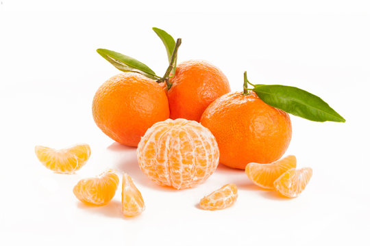 Ripe sweet tangerine with leaves