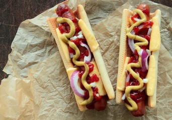 Hot dogs with mustard, ketchup and cheese
