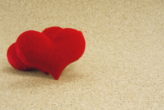 red two heart on wood ground