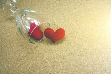 Fototapeta na wymiar red heart and clear wine glass