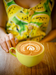 coffee latte art cup in cafe