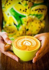 coffee latte art cup in cafe