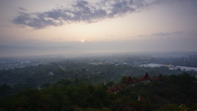 Timelapse of beautiful sunrise over Mandalay Hill. Mandalay. Myanmar. Best famous place to see sunrise at Mandalay region.