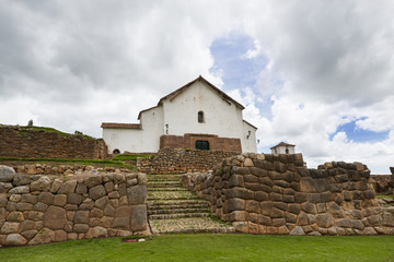 Fototapeta na wymiar Catholic church built over ancient Inca stone walls in the the village of Chinchero, in Peru
