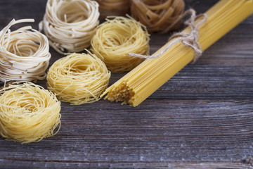 A set of raw pasta on a wooden table